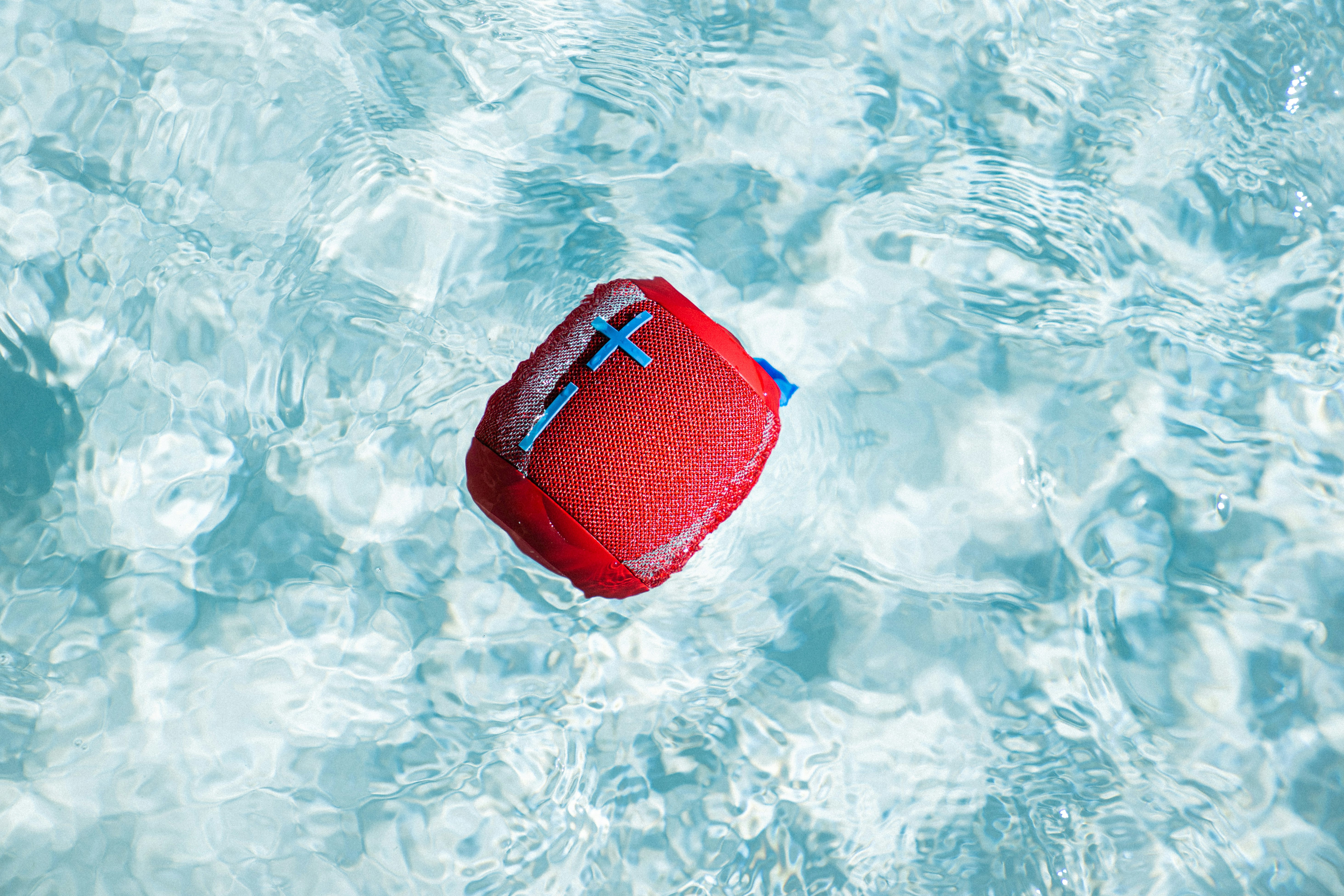 red and blue swimming cap on water